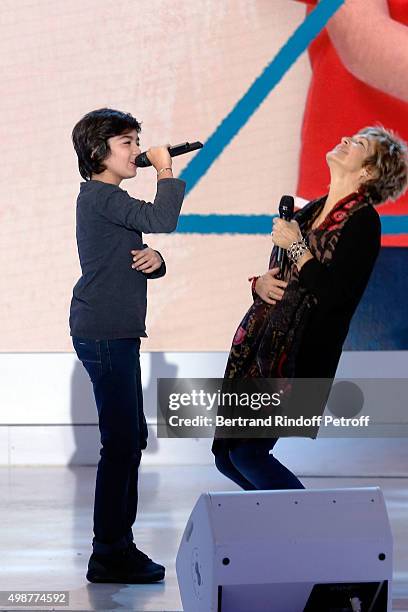 Main Guest of the show Veronique Jannot and Young Singer Paul Ventimila perform during 'Vivement Dimanche' TV Show at Pavillon Gabriel on November...