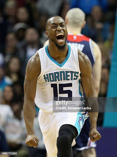 Kemba Walker of the Charlotte Hornets reacts after a play during their game against the Washington Wizards at Time Warner Cable Arena on November 25,...