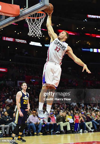 Blake Griffin of the Los Angeles Clippers dunks as Gordon Hayward of the Utah Jazz looks on during the first half at Staples Center on November 25,...