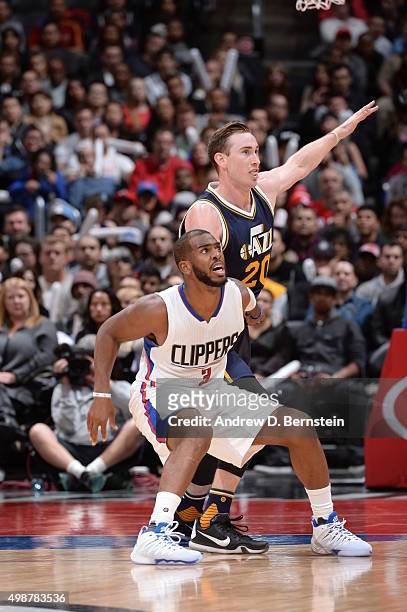 Chris Paul of the Los Angeles Clippers fights for position against Gordon Hayward of the Utah Jazz on November 25, 2015 at STAPLES Center in Los...