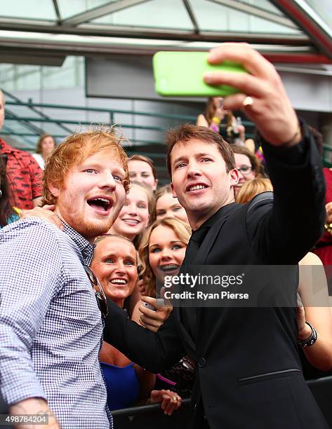 Ed Sheeran and James Blunt take a selfiewith fans on the red carpet ahead of the 29th Annual ARIA Awards 2015 at The Star on November 26, 2015 in...