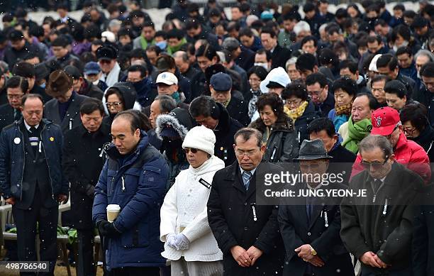 South Koreans pay a silent tribute during a state funeral ceremony for the late former South Korean president Kim Young-Sam at the National Assembly...