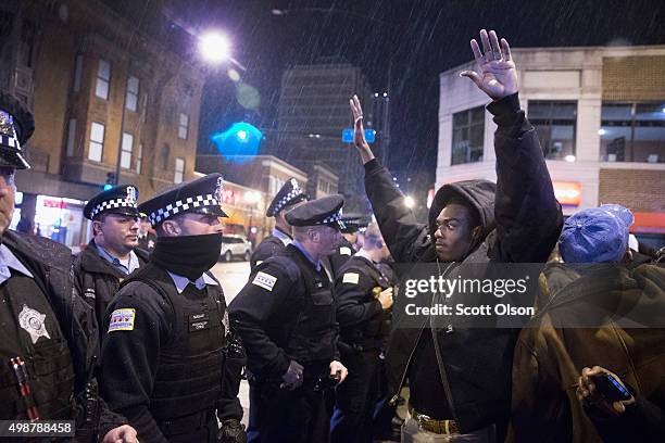 Demonstrators confront police during a protest over the death of Laquan McDonald on November 25, 2015 in Chicago, Illinois. Small and mostly peaceful...