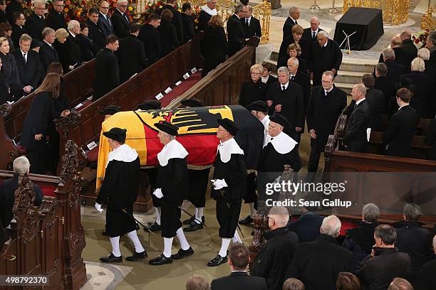 Pallbearers carry the coffin of former German Chancellor Helmut Schmidt out of Sankt Michaelis church as German President Joachim Gauck, German...