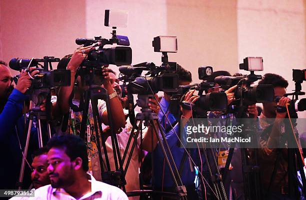 Indian camera men film during The Hero Hockey League World Final press conference ay the Taj Gateway Hotel on November 26, 2015 in Raipur, India.