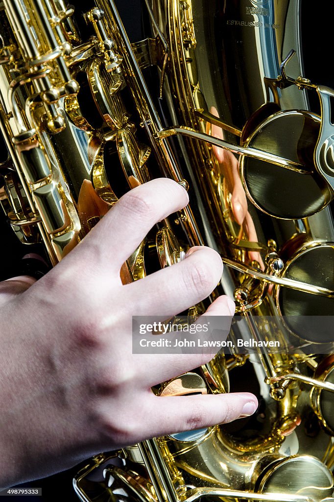 Close up of saxophonist fingering keys