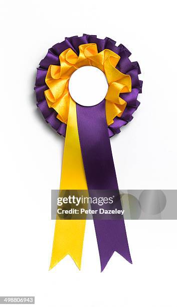 gold and purple rosette with copy space - purple ribbon stock pictures, royalty-free photos & images
