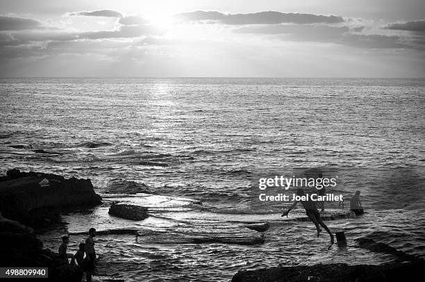 diving into the mediterranean sea in beirut, lebanon - beirut people stock pictures, royalty-free photos & images