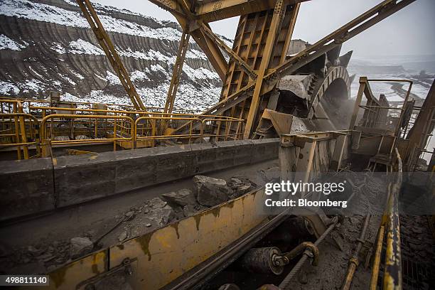 Rock sediment moves up a conveyor belt on a giant excavator during the mining of brown coal at the Bilina open pit lignite mine, operated by...