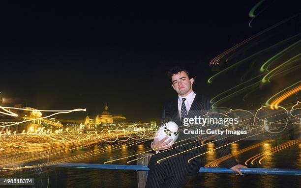 England rugby player Will Carling poses with a floodlit backdrop of St Pauls Cathedral and the City of London in 1988.