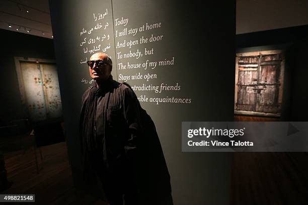 In Toronto on November 17, 2015 Celebrated Iranian filmmaker Abbas Kiarostami poses for pictures at his installation piece called Doors Without Keys...