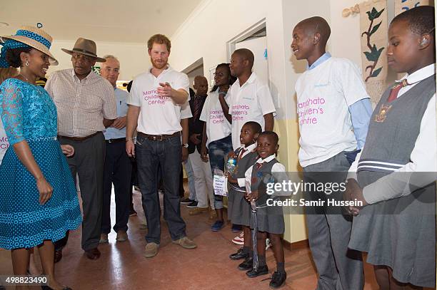 Prince Harry and King Letsie III of Lesotho meet children as they tour the opening of Sentebale's Mamohato Children's Centre during an official visit...