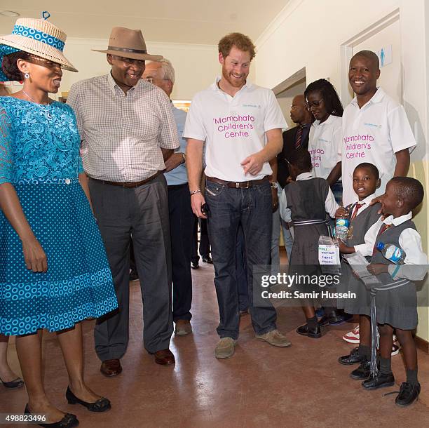 Prince Harry and King Letsie III of Lesotho meet children as they tour the opening of Sentebale's Mamohato Children's Centre during an official visit...