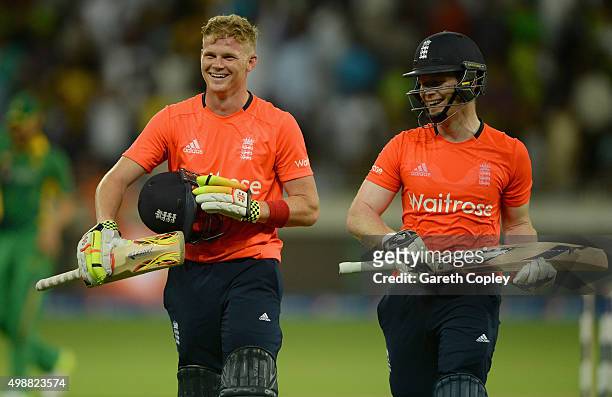 Sam Billings leaves the field alongside England captain Eoin Morgan after their innings during the 1st International T20 match between Pakistan and...