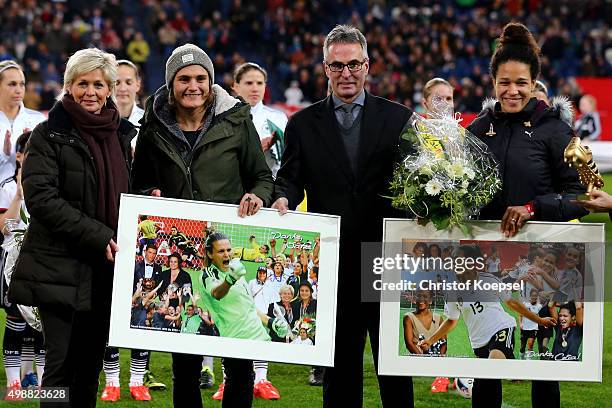 Helmut Sandrock, general secretary of DFB and head coach Silvia Neid of Germany say farewell to Nadine Angerer and Celia Sasic prior to the Women's...