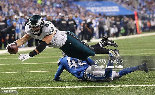 Tight end Brent Celek of the Philadelphia Eagles dives over strong safety Isa Abdul-Quddus of the Detroit Lions for a second quarter touchdown on...