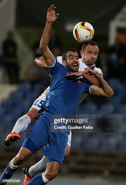 Lech Poznan's defender Dariusz Dudka with Os Belenenses forward Tiago Caeiro in action during the UEFA Europa League match between Os Belenenses and...