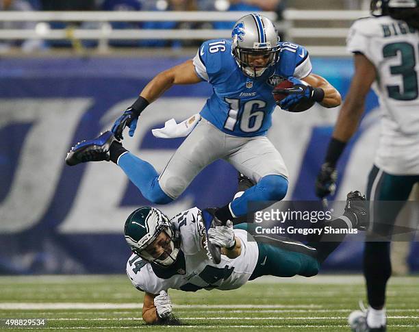 Lance Moore of the Detroit Lions is tackled by Riley Cooper of the Philadelphia Eagles after a second quarter reception at Ford Field on November 26,...