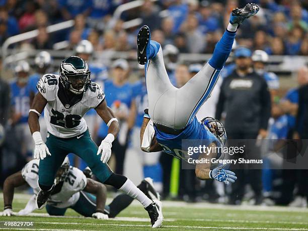 Eric Ebron of the Detroit Lions is tackled by Walter Thurmond of the Philadelphia Eagles after a second quarter reception at Ford Field on November...