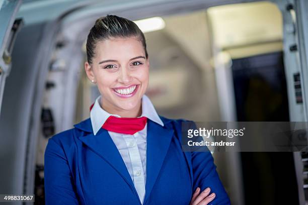 happy flight attendant - flight attendants stock-fotos und bilder