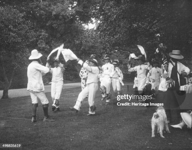 Bampton Morris Dancers, Oxfordshire, Whit Monday, 5 June 1911. William Nathan Wells playing the fiddle; Thomas Tanner, Joseph Rouse, James Dewe and...