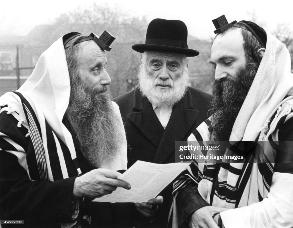 Hasidic Jews wearing tefillin and tzitzit, 1981. Artist: Sidney Harris