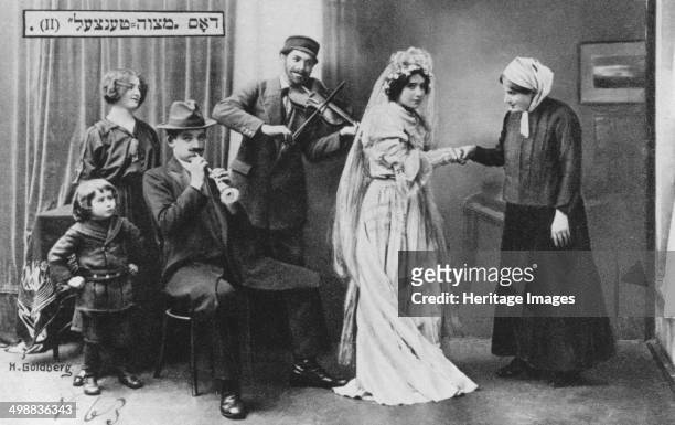 'The Wedding Mitzvah Dance', 1910. Postcard showing a Jewish bride and musicians, published by Verlag Jehudia, Warsaw, Poland.