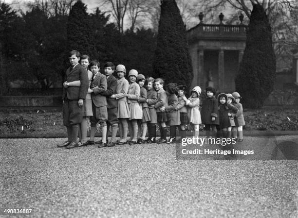 Cavendish family group of 16 grandchildren in the gardens of Chatsworth, Derbyshire, Christmas 1929. The grandchildren of Victor Cavendish, 9th Duke...