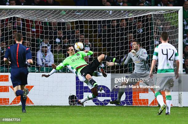 Arkadiusz Milik of Ajax scores their first and equalising goal during the UEFA Europa League Group A match between Celtic FC and AFC Ajax at Celtic...