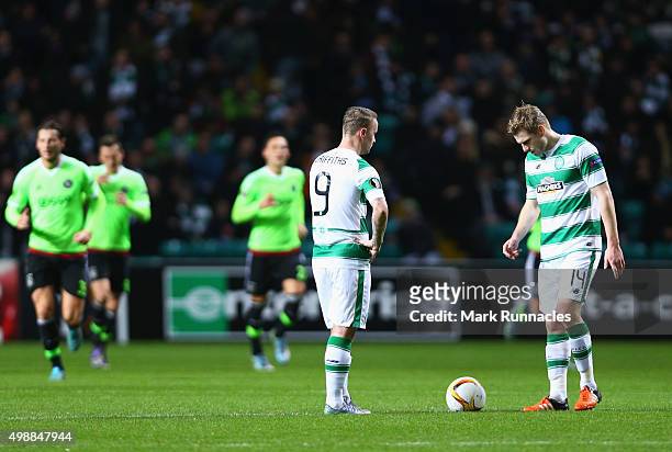 Leigh Griffiths and Stuart Armstrong of Celtic look dejected as Arkadiusz Milik of Ajax scores an equalising goal during the UEFA Europa League Group...