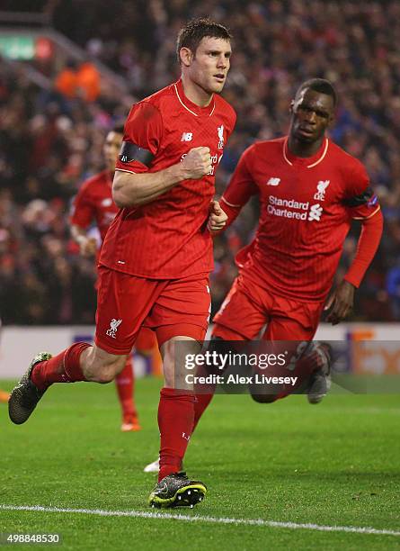 James Milner of Liverpool celebrates as he scores their first and equalising goal from the penalty spot with Christian Benteke during the UEFA Europa...