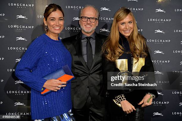 Jana Ina Zerella, Markus Wahl of Longchamp and Alina Gerber attend the Longchamp store opening on November 26, 2015 in Cologne, Germany.