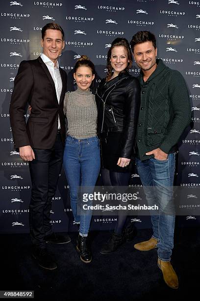 Timothy Boldt, Amrei Haardt, Laura Koppen and Milos Vukovic attend the Longchamp store opening on November 26, 2015 in Cologne, Germany.