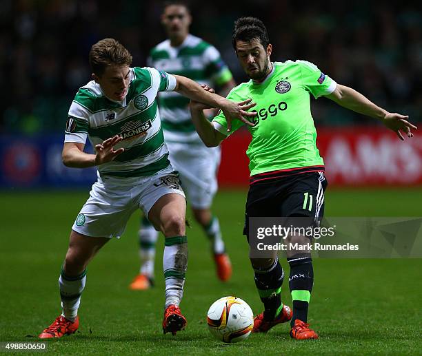 James Forrest of Celtic challenges Amin Younes of Ajax during the UEFA Europa League Group A match between Celtic FC and AFC Ajax on November 26,...