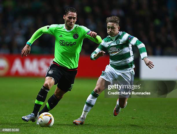 Nemanja Gudelj of Ajax is chased by Scott Allan of Celtic during the UEFA Europa League Group A match between Celtic FC and AFC Ajax at Celtic Park...