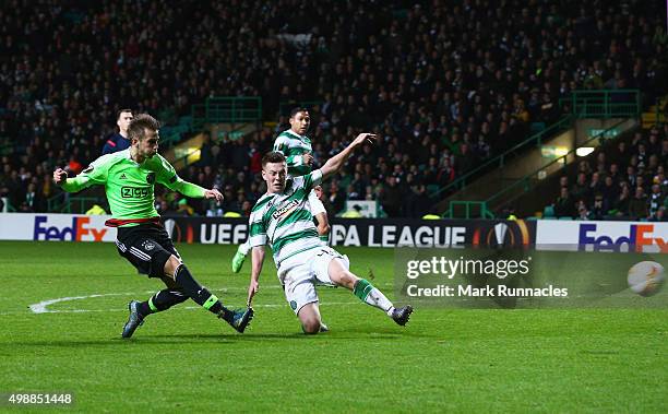 Vaclav Cerny of Ajax shoots past Callum McGregor of Celtic to score their second goal during the UEFA Europa League Group A match between Celtic FC...