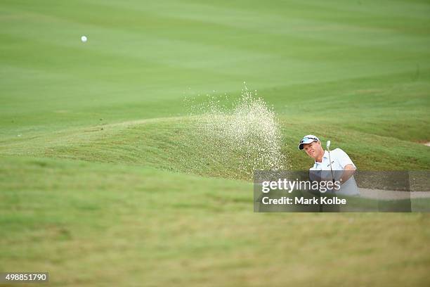 John Senden of Australia plays a bunker shot on the 11th hole during day two of the Australian Open at the Australian Golf Club on November 27, 2015...