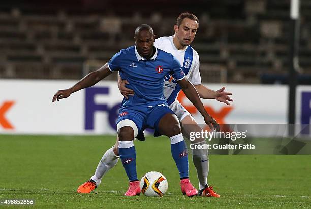 Os Belenenses' forward Luis Leal with KKS Lech Poznan's defender Dariusz Dudka in action during the UEFA Europa League match between Os Belenenses...