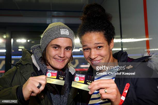 Nadine Angerer and Celia Sasic pose with the membership cards of the Fanclub Nationalmannschaft during the Meet and Greet prior to he Women's...