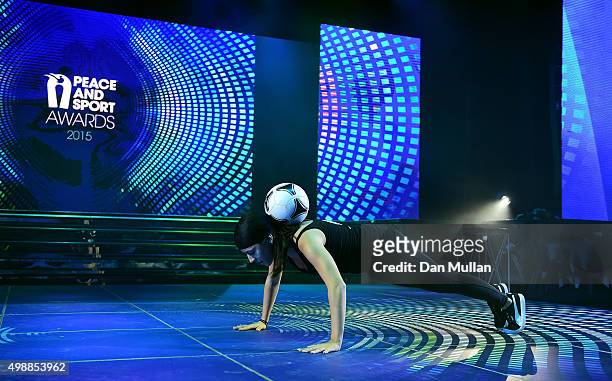 Alice Fougeray performs a freestyle football routine during the Peace & Sport Gala Dinner at the Sporting Club on November 26, 2015 in Monaco, Monaco.