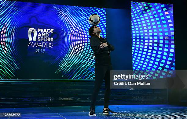 Alice Fougeray performs a freestyle football routine during the Peace & Sport Gala Dinner at the Sporting Club on November 26, 2015 in Monaco, Monaco.