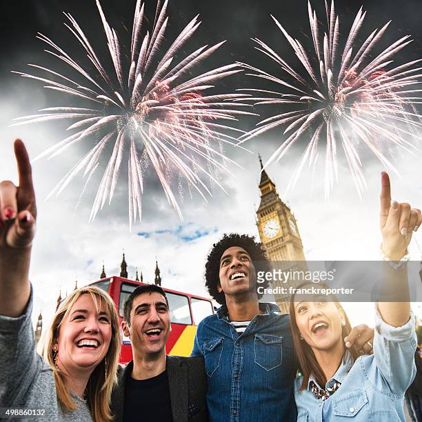 friends have fun in london with firework on the background - big ben fireworks stock pictures, royalty-free photos & images