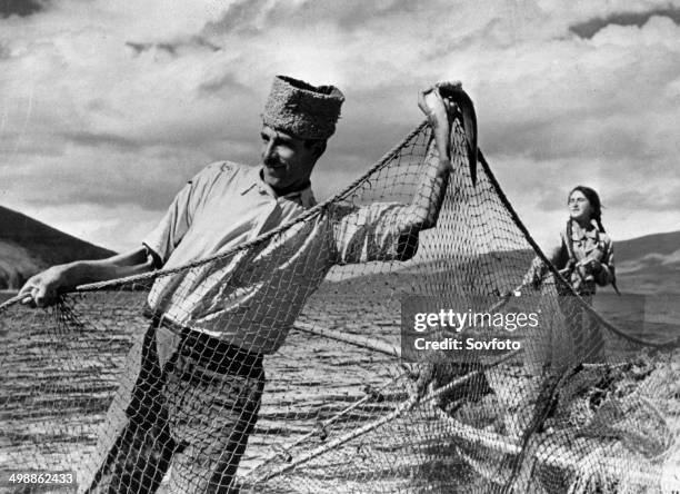 Armenian repatriation. Avetis Tilbian, who arrived in Soviet Armenia from Beirut, fishing on Lake Sevan after joining a collectivized fishery. Late...