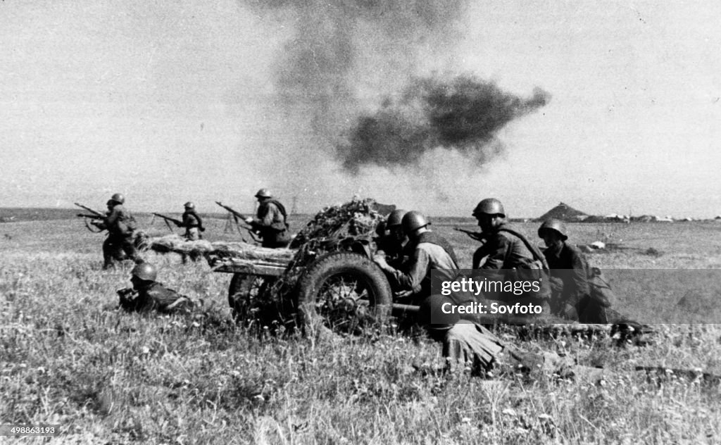 World War 2. A Soviet gun crew covering the advance of an infantry unit on the Southern Front