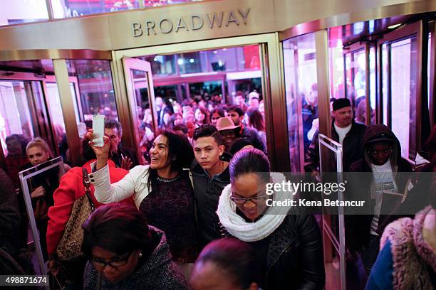 Customers stream into Macy's flagship store in Herald Square on Thanksgiving evening for early Black Friday sales on November 26, 2015 in New York...