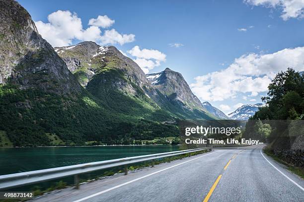 scene of innvik fjord - norway road stock pictures, royalty-free photos & images