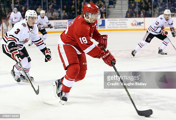 Ben Jones of the Niagara IceDogs chases Blake Speers of the Sault Ste Marie Greyhounds during an OHL game at the Meridian Centre on November 26, 2015...