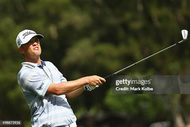 Matthew Jones of Australia plays an approach shot on the 1st hole during day two of the Australian Open at the Australian Golf Club on November 27,...