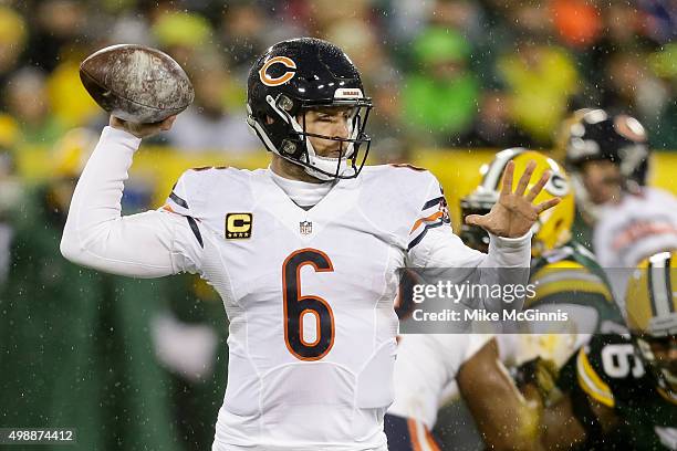 Quarterback Jay Cutler of the Chicago Bears looks to pass in the first quarter against the Green Bay Packers at Lambeau Field on November 26, 2015 in...