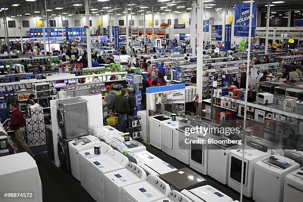 Shoppers browse merchandise inside a Best Buy Co. Store ahead of Black Friday in Chesapeake, Virginia, U.S., on Thursday, Nov. 26, 2015. In 2011,...